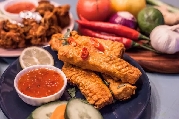 Battered fish fillets served with sweet chilli dipping sauce