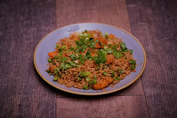 Nepalese-style fried rice with vegetables and coriander