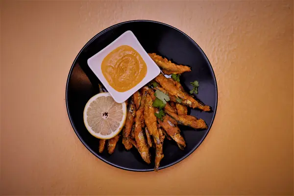Crispy fried whitebait served with lemon and dipping sauce