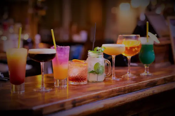 Selection of cocktails lined up on the bar counter
