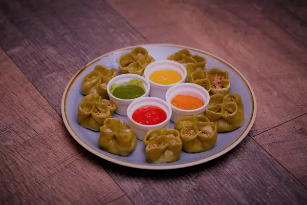 Spinach momo served with four house chutneys