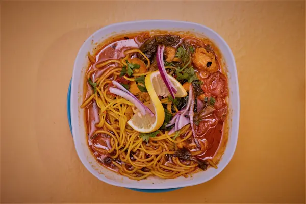 Noodle soup with vegetables and lemon