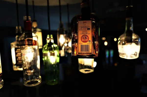 Pendant lights made from repurposed spirit bottles